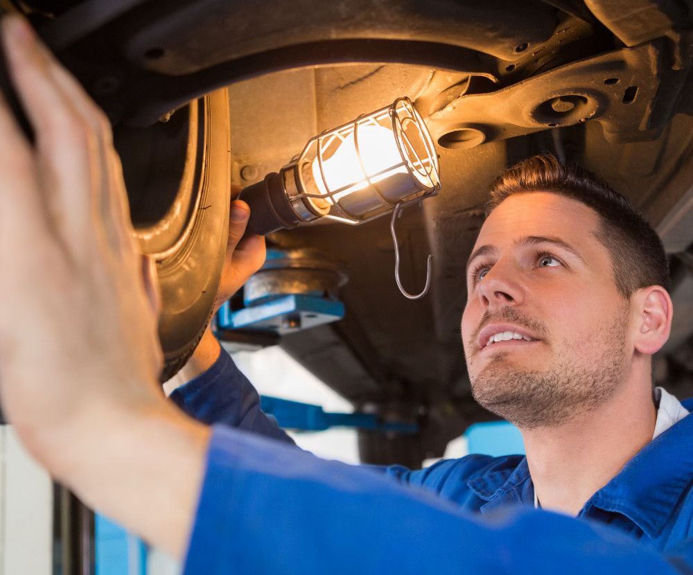 Mot mechanic inspecting a vehicle - MOT Glasgow