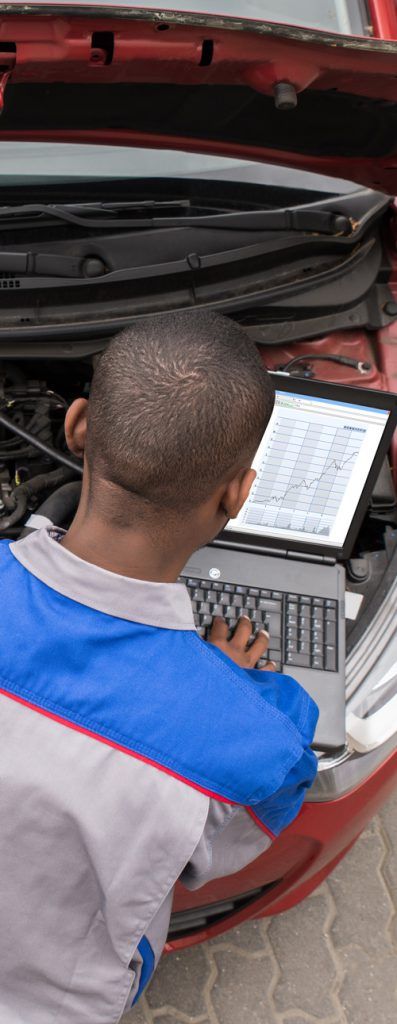 Mechanic diagnosing a vehicle using a pc - Tuning & Remapping in Glasgow